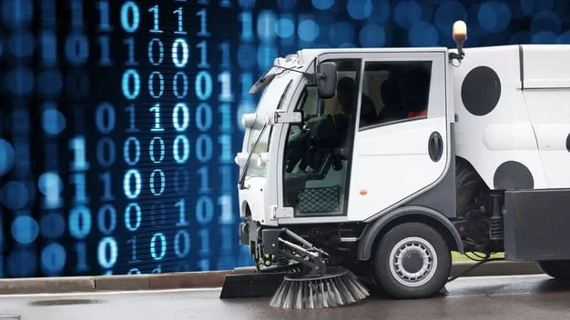 street sweeper in front of blue wall of data coencorp sm2 automated engine data capture