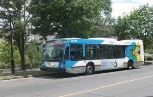 transit bus driving off from station being managed by Coencorp fleet management software.