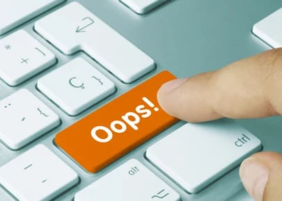 fleet manager pressing the 'oops' key on the computer keyboard