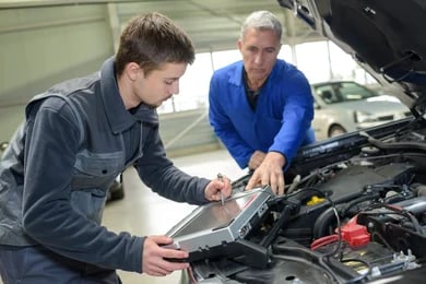 Mechanic Training apprentice in a maintenance garage