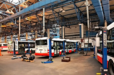 city buses being serviced in maintenance bay sm2-fuel transit