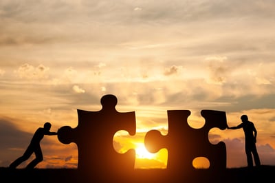 AdobeStock_109067861-giant puzzle peices at sunset