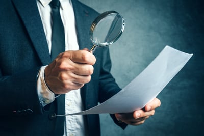 AdobeStock_111306547-Inspecting Paper