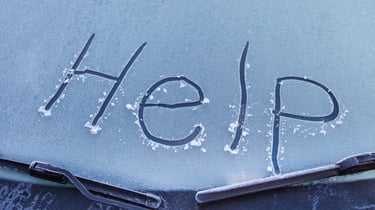 Faulty windshield wipers showing frosted front windshield of a fleet city transit bus.