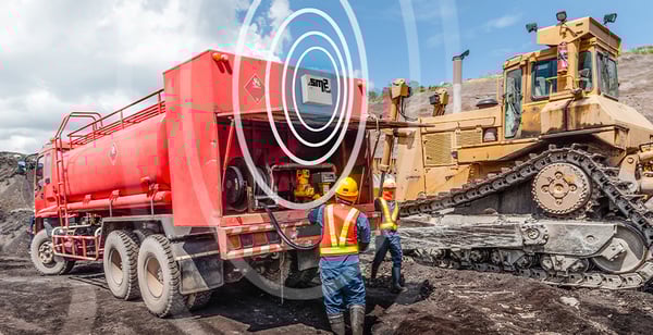 fuel-truck-managed-by-sm2-fuel-mobile-with-rf-waves-next-to-bulldozer