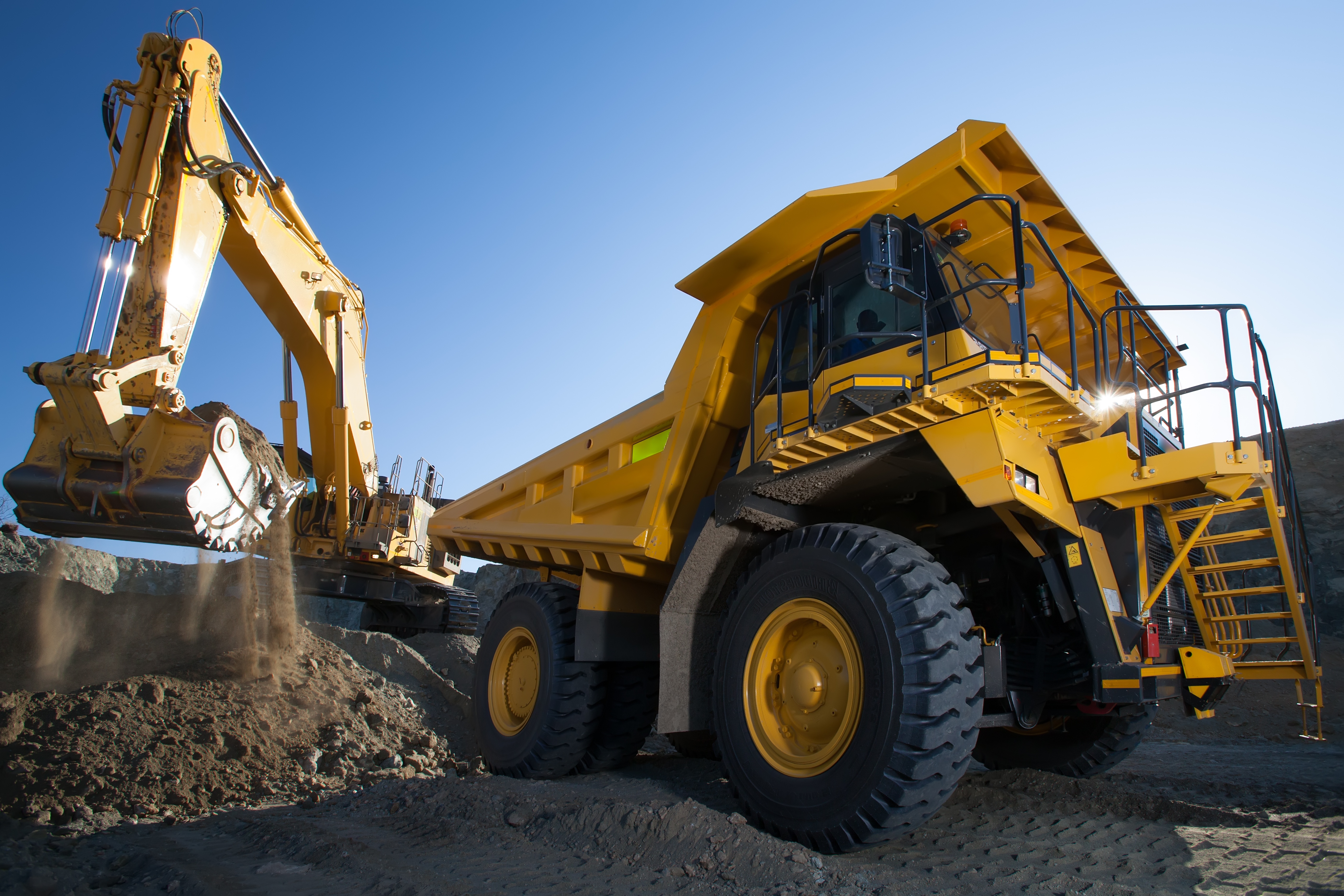 Open pit mining operations where equipment like loaders and trucks require mobile fueling operations.