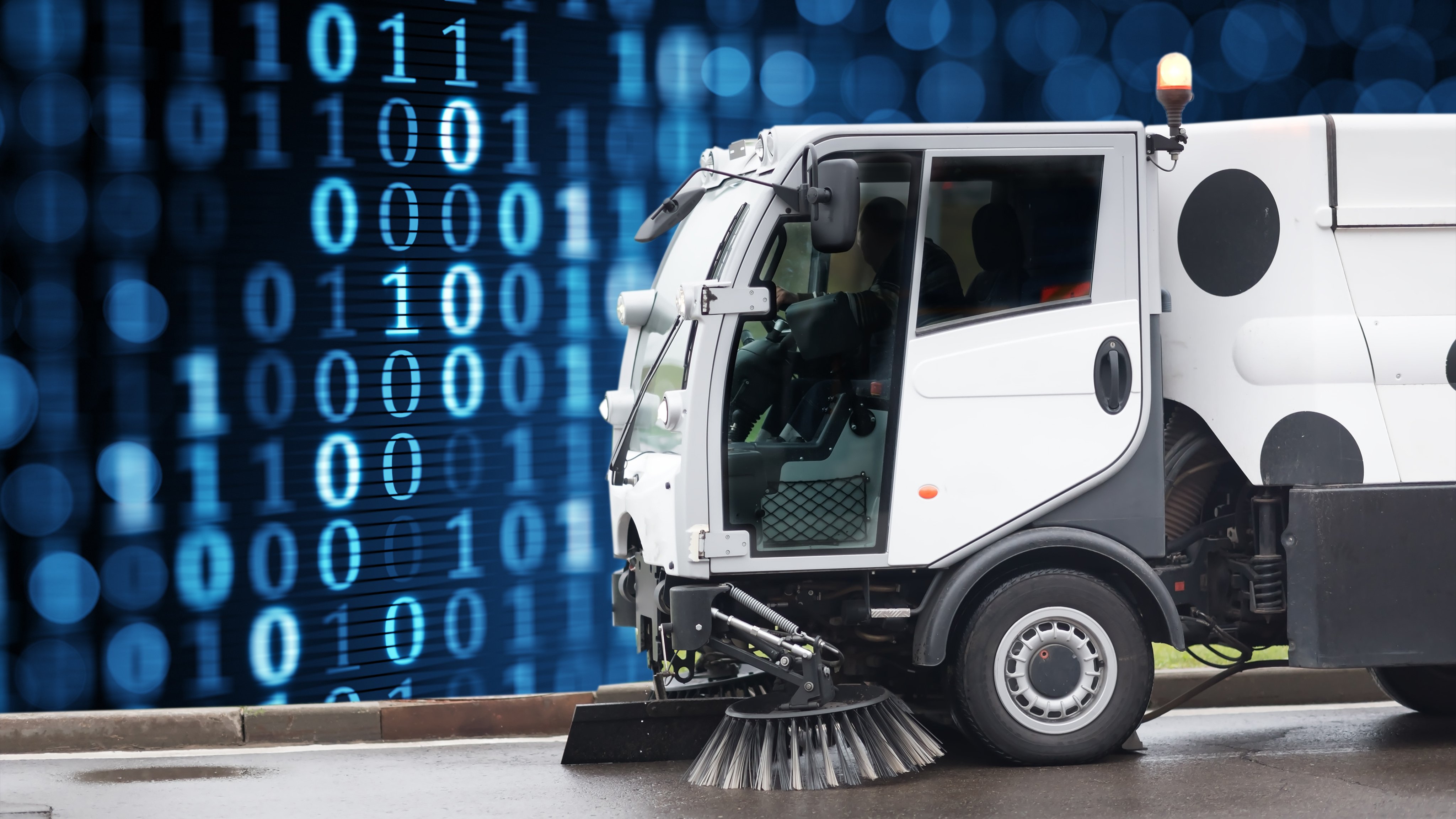 street-sweeper-in-front-of-blue-wall-of-data-coencorp-sm2-automated-engine-data-capture