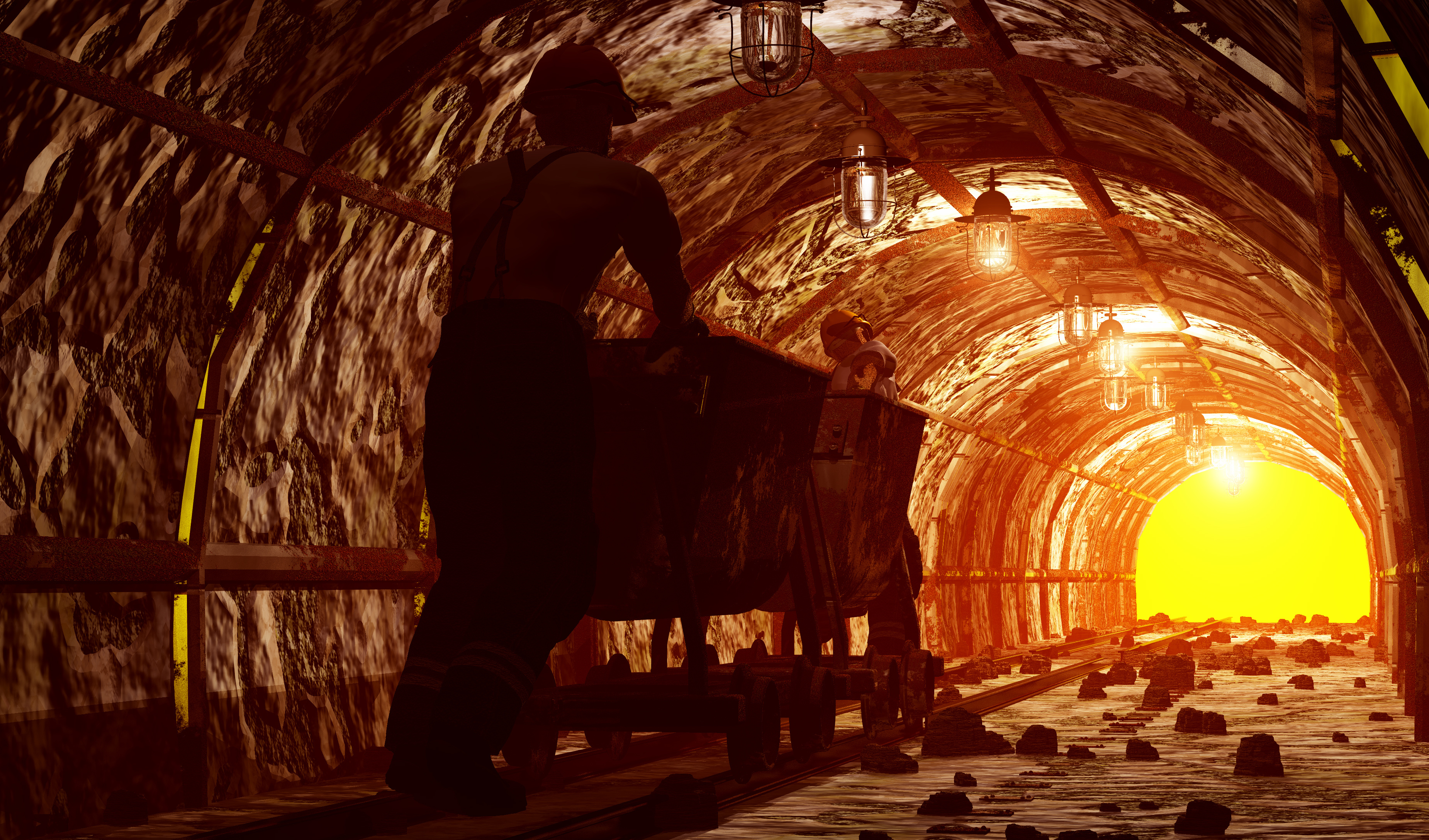 Miner Pushing underground ore cart on rails - Part of a mining fleet operation.